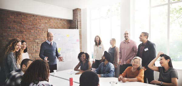 group of diverse employees at table mobile