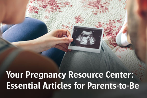 couple looking at ultrasound picture