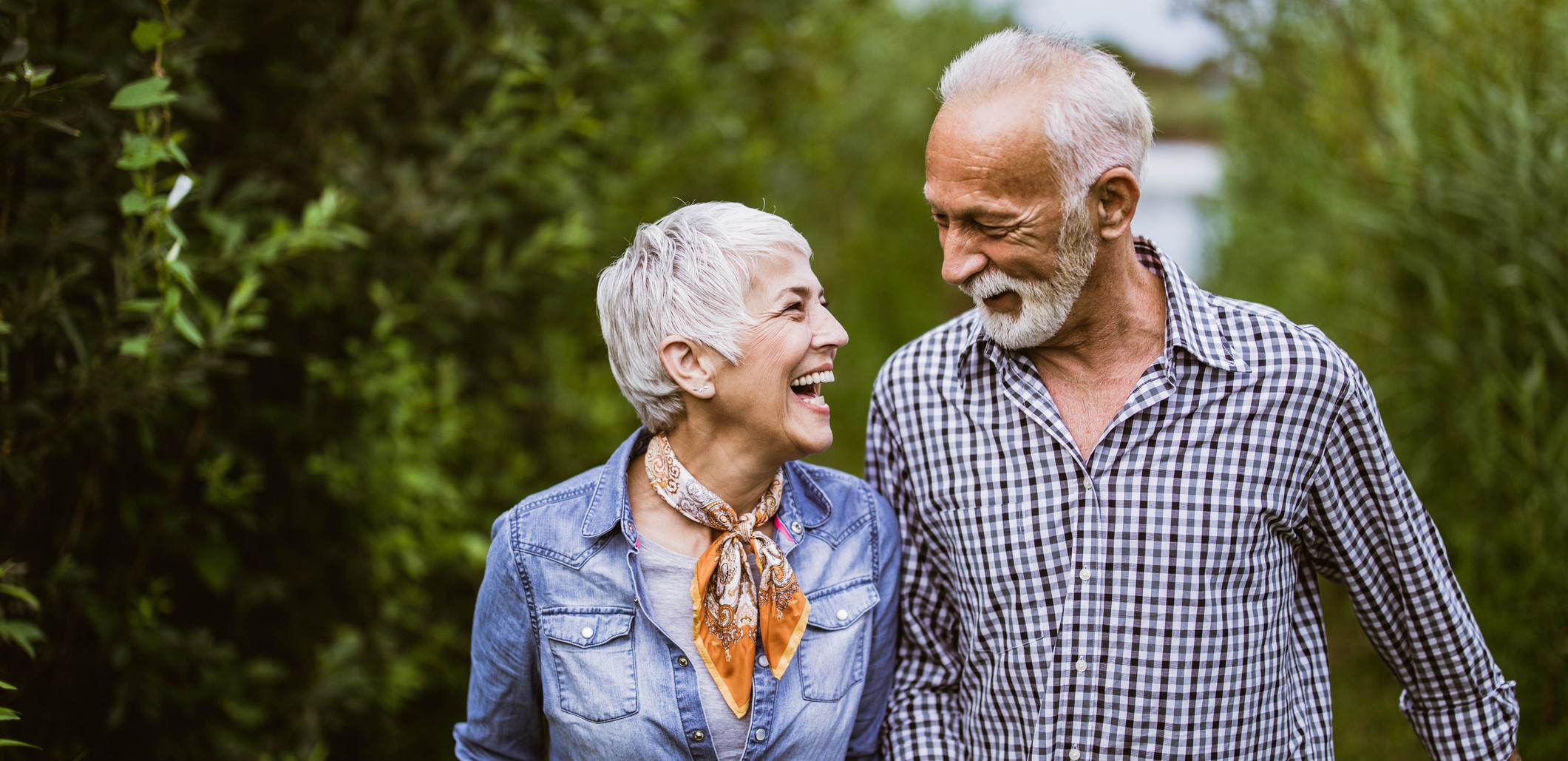 medicare aged couple in the woods